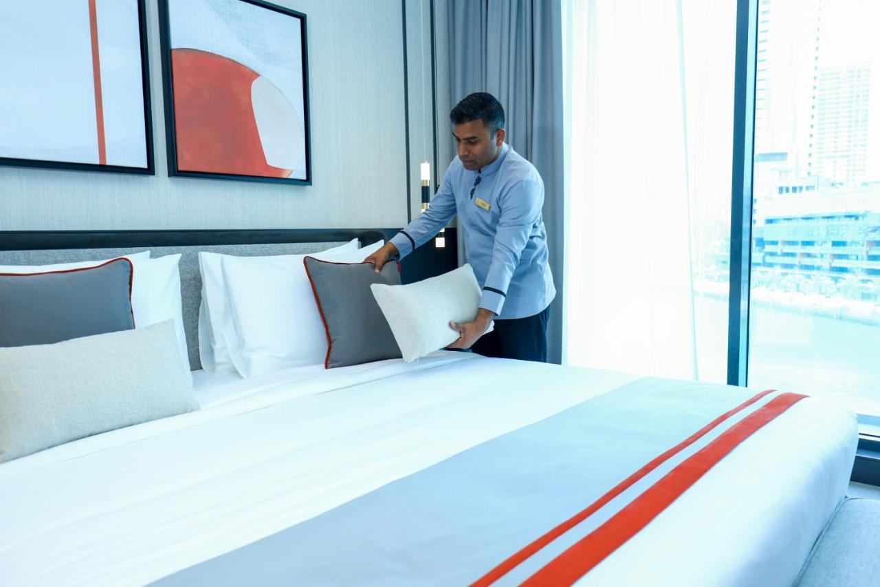 Charthouse Bahrain Hotell Manama Exteriör bild A hotel housekeeper making a bed